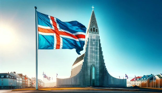 Bandiera dell'Islanda sventolante davanti alla Chiesa di HallgrÃ­mskirkja nella capitale Reykjavik