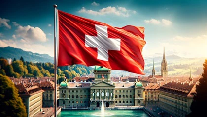 Bandiera della Svizzera sventolante davanti al Palazzo Federale nella capitale Berna